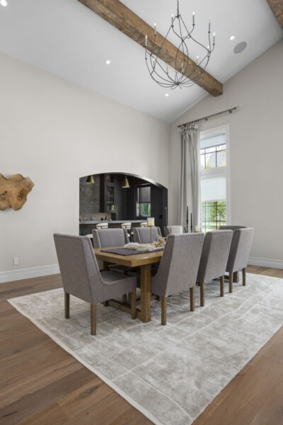 Upholstered dining chairs around a rectangular wood table.