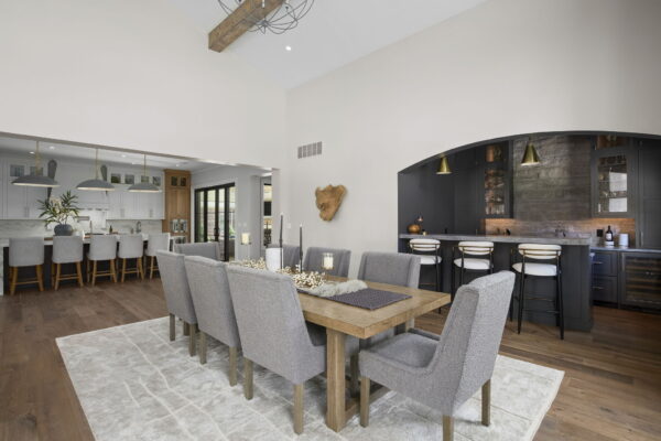 Upholstered dining chairs around a rectangular wood table.