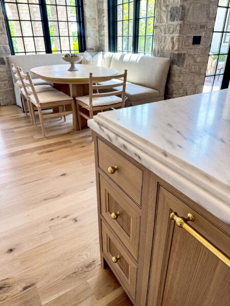 Detail of a honed marble countertop with a stacked cove and quarter round edge profile.